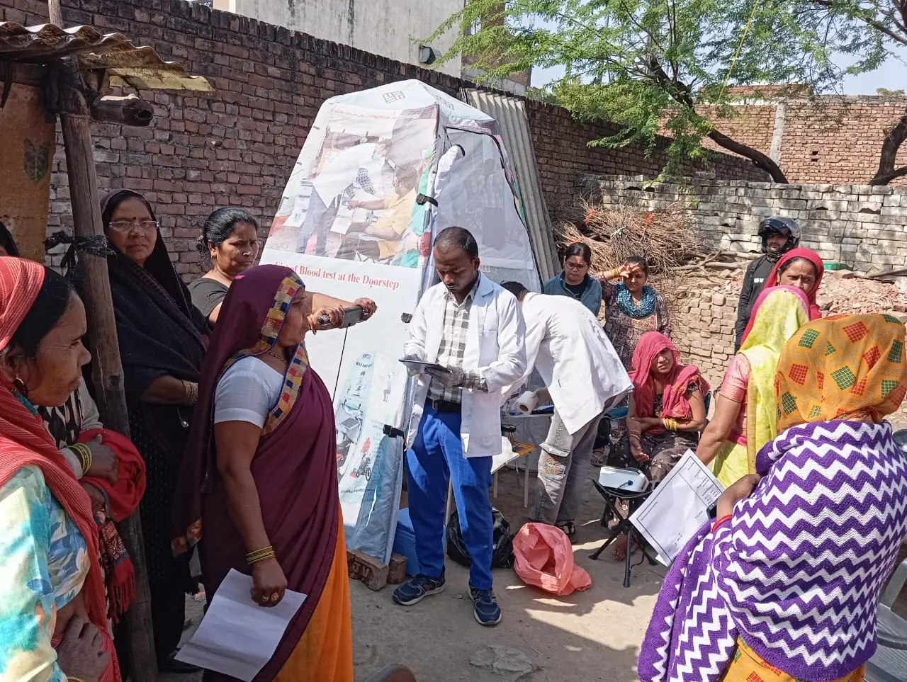 Community members gathered around a Swasthgram health service
